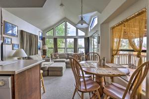 a kitchen and living room with a table and chairs at Bright Fairplay Cabin with Deck and All-Seasons Fun! in Fairplay