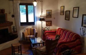 a living room with a couch and two chairs at Casa Cuculo - Rustico mit traumhaftem Meerblick in Scansano