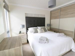 Ένα ή περισσότερα κρεβάτια σε δωμάτιο στο 44 Heritage Park