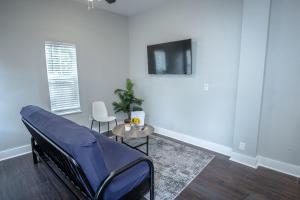 a hospital room with a bed and a tv at Remodeled Historic 1BR 1BA House Near Downtown in San Antonio