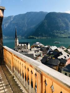 a view from a balcony of a town and a lake at Apartment Müllerstiege in Hallstatt