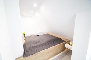 Posteľ alebo postele v izbe v ubytovaní Pozytywny Apartament przy Rynku