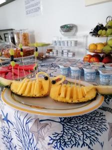 a table topped with plates of food at Diana Brown B&B Affittacamere in Lipari