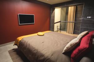 Postel nebo postele na pokoji v ubytování Hotel Portofino