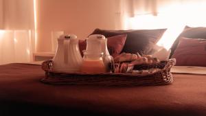 a basket of milk and cookies on a bed at Punto Playa in Villa Gesell