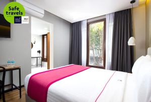 Кровать или кровати в номере Hotel MX más reforma