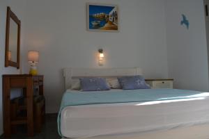 Postel nebo postele na pokoji v ubytování Klados Studios & Apartments