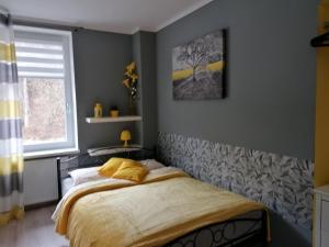 Posteľ alebo postele v izbe v ubytovaní Apartament Grosik