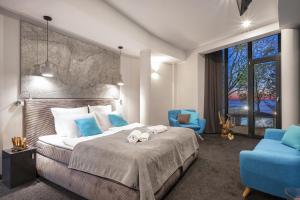 a bedroom with a bed with two stuffed animals on it at Max Health Resort SPA in Ustronie Morskie +114 photos