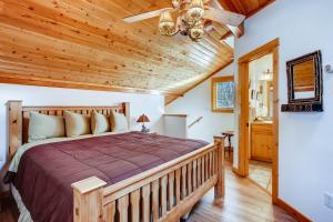 a bedroom with a bed and a wooden ceiling at Estes Park Condos in Estes Park