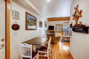 a kitchen and dining room with a table and chairs at Estes Park Condos in Estes Park