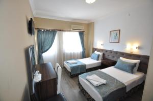 Postel nebo postele na pokoji v ubytování Reis Maris Hotel