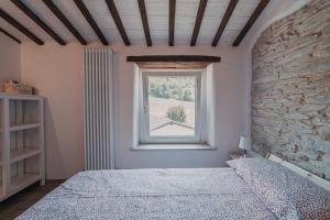 A bed or beds in a room at Casale di Nicolò