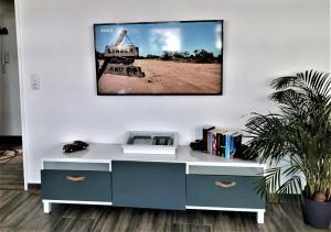 an office with a desk with a tv on the wall at Bremen City in Bremen