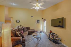 a living room with a couch and a flat screen tv at Mountain View GetAway in Stone Mountain
