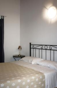 En eller flere senge i et værelse på Hotel La Rosta