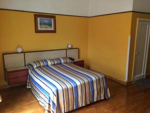 Postel nebo postele na pokoji v ubytování Hotel Isabel