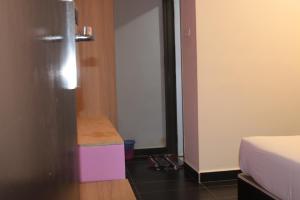 Postel nebo postele na pokoji v ubytování Bayu View Hotel Melaka