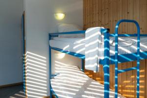 Voodi või voodid majutusasutuse Mont-Fort Swiss Lodge toas