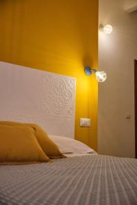 Posteľ alebo postele v izbe v ubytovaní OlioeAlloro B&B
