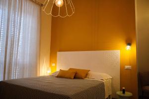 Posteľ alebo postele v izbe v ubytovaní OlioeAlloro B&B