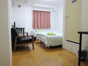 En eller flere senge i et værelse på ホテル中央セレーネ Hotel CHUO SELENE