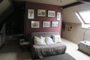 Postel nebo postele na pokoji v ubytování B&B / Studio De Druivelaar in hartje Kluisbergen (Berchem)