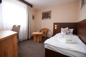 Postel nebo postele na pokoji v ubytování Hotel Stella