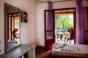 A bed or beds in a room at Kalypso studio Resorts