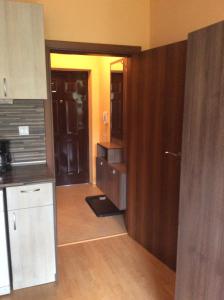 a room with a kitchen and a door leading into a kitchen at Marina Studio in Burgas City