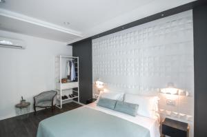 En eller flere senge i et værelse på Locanda Il Carugio