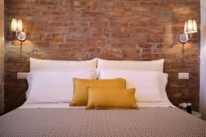 Posteľ alebo postele v izbe v ubytovaní OlioeAlloro B&B