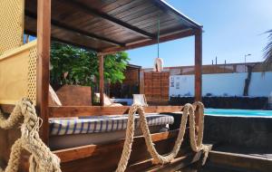 a wooden boat with ropes on the deck at Finca Villa Lucía - Los Hervideros in Mácher