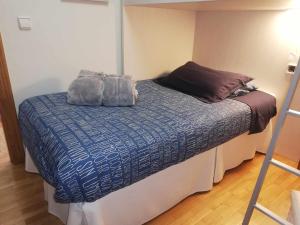 Łóżko lub łóżka w pokoju w obiekcie La casa del gatico