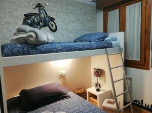 Łóżko lub łóżka w pokoju w obiekcie La casa del gatico