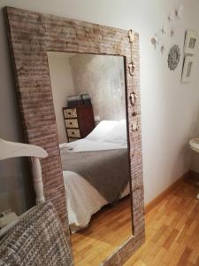 Łóżko lub łóżka w pokoju w obiekcie La casa del gatico