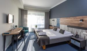 Postel nebo postele na pokoji v ubytování UPA Medical SPA + 37 fotografií