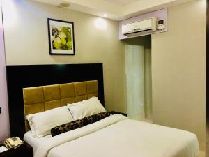 Ένα ή περισσότερα κρεβάτια σε δωμάτιο στο BW Starfire Hotel