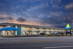 a hotel with a sign on the side of a road at Days Inn by Wyndham Apopka/Orlando in Orlando