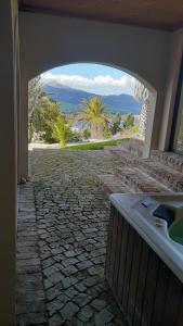 a bathroom with a view of a stone walkway at Barton Luxury Villas in Botrivier