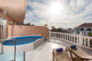 a balcony with a plunge pool on a house at Hotel Cleopatra Palace in Playa de las Americas