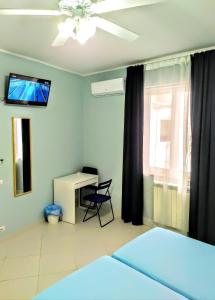 TV a/nebo společenská místnost v ubytování Hello B&B