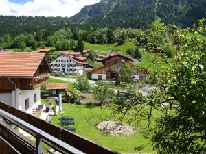 a view from a balcony of a village with mountains at Sägerhof Bader in Rettenberg