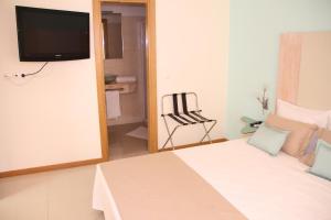 TV a/nebo společenská místnost v ubytování Sol Hotel