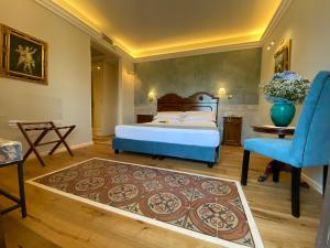 Ένα ή περισσότερα κρεβάτια σε δωμάτιο στο Hotel Foresteria Baglio Della Luna