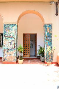an entrance to a building with a colorful mosaic doorway at B&b Mondello Resort in Palermo