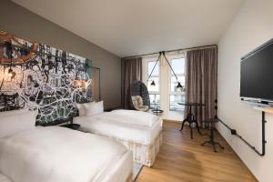 Postel nebo postele na pokoji v ubytování Seminaris Hotel Nürnberg + 37 fotografií