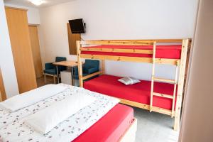 A bed or beds in a room at Garni Birkenau