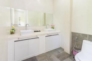 a white bathroom with two sinks and a toilet at Villa Zen Sushi in Lamai +31 photos