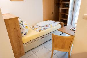 A bed or beds in a room at Garni Birkenau